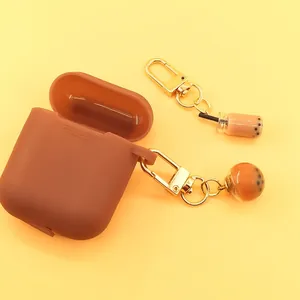 Brown silicone earphone case with creative bubble tea cup keychain pendants for AirPods