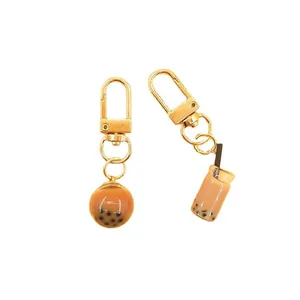 Creative bubble tea keychain set with realistic liquid resin and golden clasp