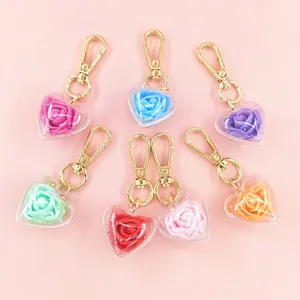 Heart-shaped rose preserved flower keychains in seven vibrant colors with gold metal clasps