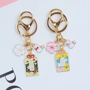 Japanese style cherry blossom and rabbit charms keychain with golden alloy finish