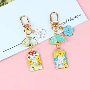 Porte-clés Omamori japonais avec pendentifs fleur de cerisier et éventail pour sacs