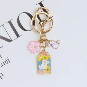 Japanese Omamori cherry blossom keychain with white rabbit charm and golden metal ring