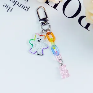 Detail of glitter acrylic bear keychain with colorful plastic links and a metal lobster clasp