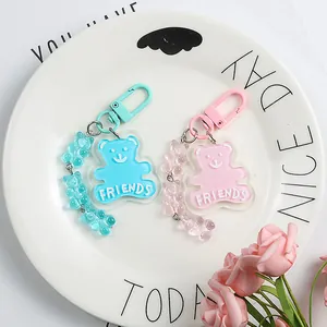 Cute acrylic bear keychain with mini bear chain and friends text in pink and blue