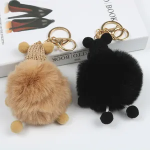 Simpatico portachiavi a pallina di peluche nero e kaki per decorazione borsa a mano