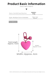 Pink heart-shaped bell keychain detail with measurements of 7.2cm length and 8.6g weight