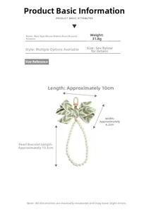 Detailed view of ribbon pearl keychain with leaf pattern bow and golden clasp size specs