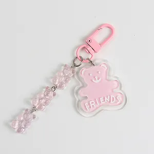 Detailed view of pink acrylic bear charm with FRIENDS text and resin gummy bear chain