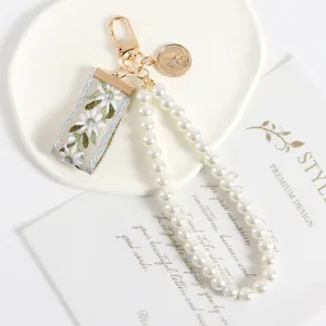 Vintage pearl and shell ribbon keychain accessory for bags with retro coin charm