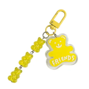 Cute yellow acrylic bear keychain with Friends text and mini gummy bear charms