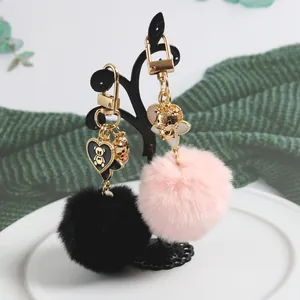 Plush heart and bear keychain set in pink and black with golden metal clasps