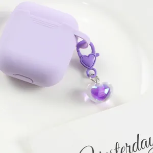 Cute light purple silicone case for Apple AirPods with a jelly heart pendant accessory