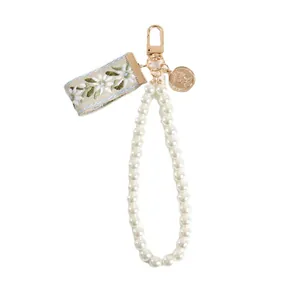 Vintage pearl bracelet keychain with floral ribbon and gold coin pendant accessory