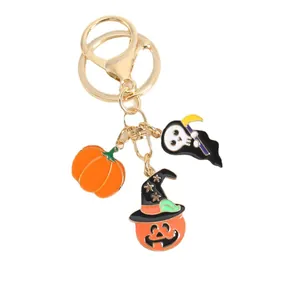 Halloween metal keychain featuring pumpkin ghost and witch hat pendants on gold ring