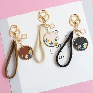 Chinese style PU leather floral keychain set with daisy embroidery in brown beige and black