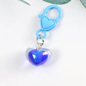 Detail of gradient blue and purple translucent heart keychain with blue lobster clasp