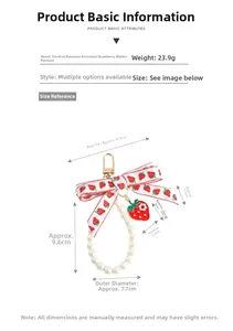 Detail view of strawberry charm keychain with pearls and ribbon dimensions and 23.9g weight