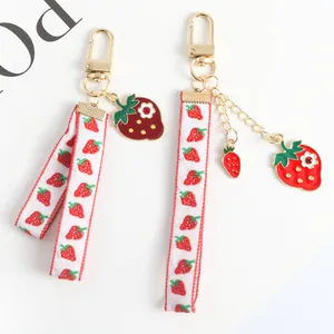 Cute strawberry pearl keychain with fruit ribbon for handbags and airpods cases