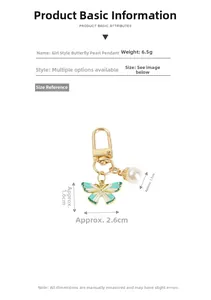 Detailed view of 6.5g butterfly pearl keychain charm with 2.6cm enamel wing and pearl