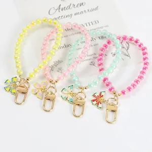 Colorful acrylic beaded keychain charms with butterfly pendants and golden clasps