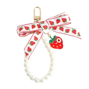 Cute strawberry pearl keychain with ribbon bow for bags and earphone cases