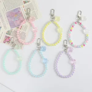 Detail of colorful acrylic bead flower keychains in six pastel macaron shades