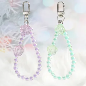 Crystal flower bead keychains in lavender and mint green with metallic clasps