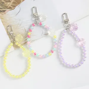 Close-up of colorful acrylic flower bead keychains with silver metal lobster clasps