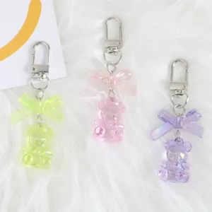 Detailed trio of iridescent bear charms in lime green, cherry pink, and lavender purple