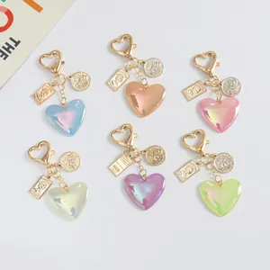 Retro colorful resin heart keychains with gold charms in six vibrant pastel colors