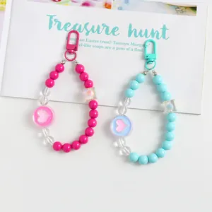 Handmade colorful acrylic heart beaded phone charms and keychains in pink and cyan blue