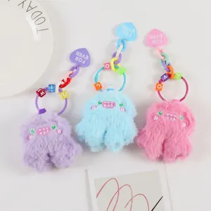 Cute monster plush keychains in pink, blue and purple with colorful letter beads