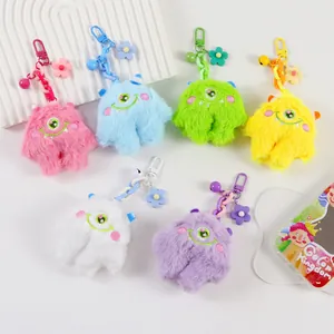 Cute fuzzy one-eyed monster keychains in pastel colors for backpacks and keys