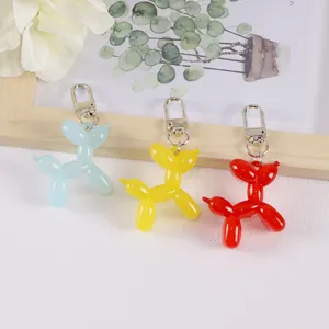 Cute jelly balloon dog keychains in blue, yellow and red colors with silver metal clasps