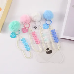 Faux pearl phone charms with plush pom-poms and For Ever heart pendants in 4 colors