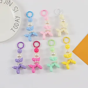 Collection of colorful balloon dog keychains with pearl beads and matching round charms