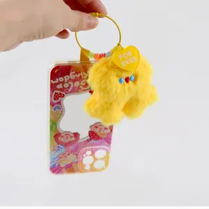 Cute pink plush doll keychain with yellow FOR EVER heart tag on a clear phone case