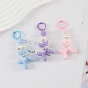 Creative resin balloon dog keychains with pearls in pastel blue, purple, and pink