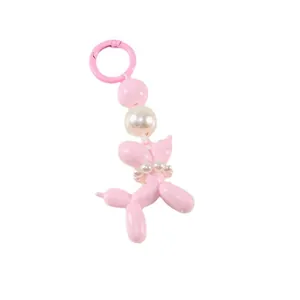 Pink resin balloon dog keychain with pearl beads and matching plastic hook accessory