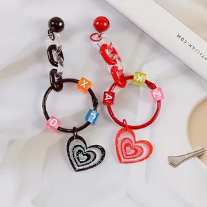 Simpatici portachiavi a cuore con perline colorate e ciondoli glitterati per borse