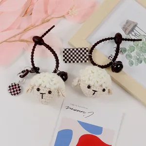 Handmade crochet lamb hair ties set with cream wool, metal bells and checkered charms