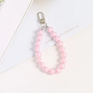 Detailed view of translucent pink acrylic bead keychain with silver lobster clasp hook