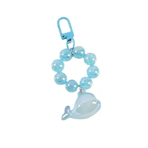 Blue whale beaded keychain with pearlescent resin charms and blue D-ring buckle