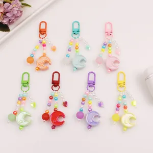Colorful moon bead keychain set with heart charms and stars in seven vibrant colors