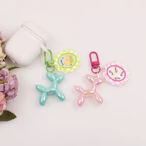 Portachiavi a forma di cane palloncino laser perlato in menta e rosa con ciondolo