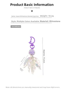 Macro shot of sweet rhinestone keychain with purple beads and leaf charms