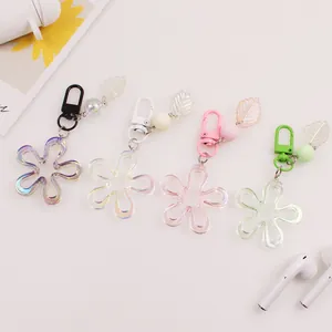 Floral acrylic keychain charms in four pastel colors with leaf pendants and colorful carabiners