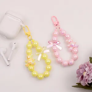 Beaded wrist lanyard with colorful bear and bow pendants for phone or earphone cases