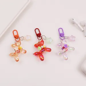 Portachiavi cane palloncino colorati in arancione, rosso e viola con stelle e perle