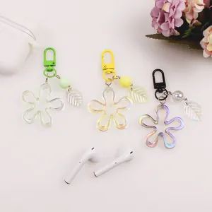 Detailed view of colorful acrylic flower keychains with translucent leaf pendants